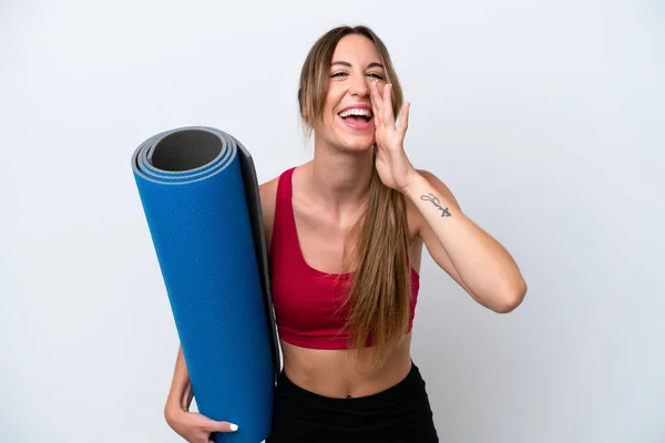 Young Sport Woman Going Yoga Classes While Holding Mat Isolated — Foto Stock