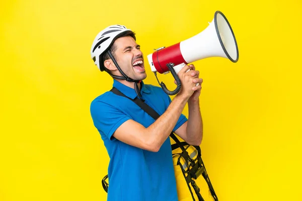Young Handsome Man Thermal Backpack Isolated Yellow Background Shouting Megaphone — Stock Photo, Image