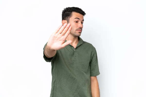 Joven Hombre Guapo Sobre Fondo Blanco Aislado Haciendo Gesto Parada —  Fotos de Stock