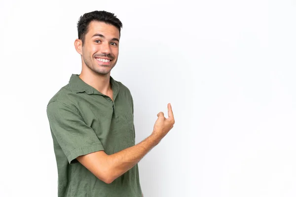 Jeune Homme Beau Sur Fond Blanc Isolé Pointant Vers Arrière — Photo