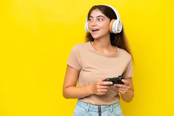Young Caucasian Woman Playing Video Game Controller Isolated Yellow Background — Photo