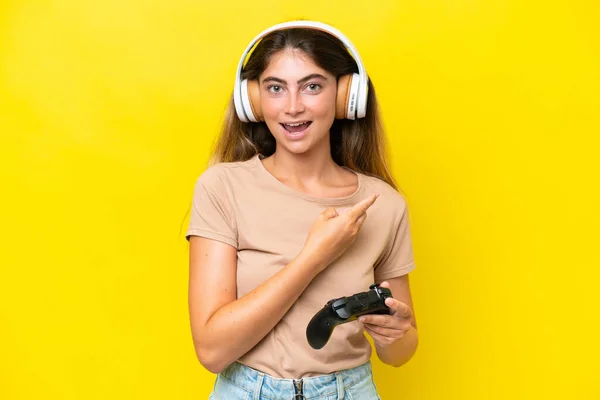 Young Caucasian Woman Playing Video Game Controller Isolated Yellow Background —  Fotos de Stock