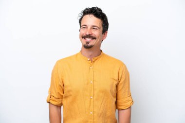 Young man with moustache isolated on white background thinking an idea while looking up