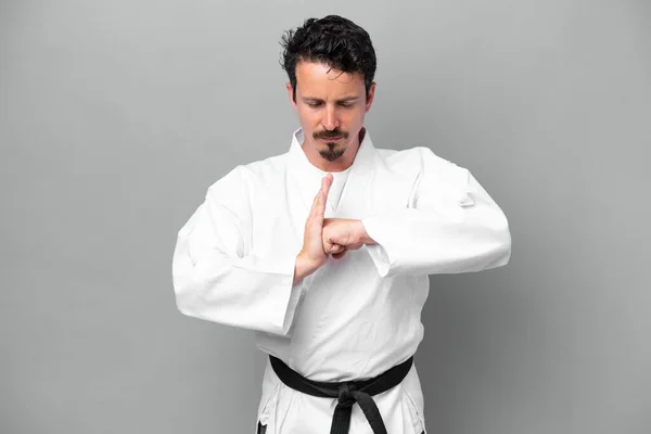 Young Caucasian Man Isolated Grey Background Doing Karate Saluting —  Fotos de Stock