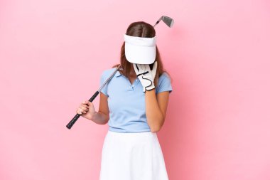 Young golfer player man isolated on pink background with tired and sick expression