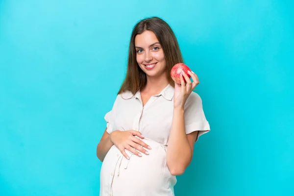 Young Caucasian Woman Isolated Blue Background Pregnant Holding Apple — Fotografia de Stock