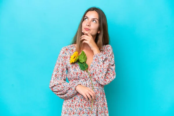 Young Caucasian Woman Holding Sunflower Isolated Blue Background Looking — Stock Photo, Image
