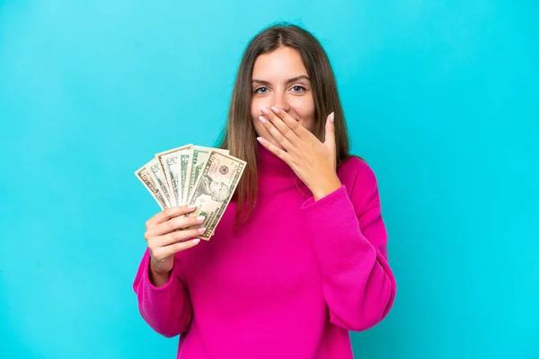 Joven Mujer Caucásica Tomando Montón Dinero Aislado Sobre Fondo Azul — Foto de Stock