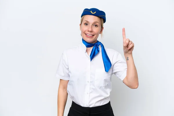 飛行機ブロンドスチュワーデス女性隔離上の白い背景ショーと持ち上げる指で最高のサイン — ストック写真