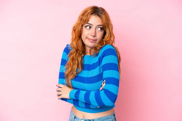 Young Caucasian Woman Isolated Pink Background Making Doubts Gesture While — Stock Photo, Image