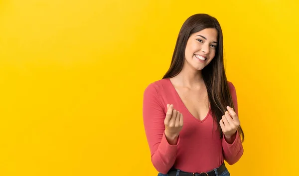 Tiener Braziliaanse Meisje Geïsoleerde Gele Achtergrond Het Maken Van Geld — Stockfoto