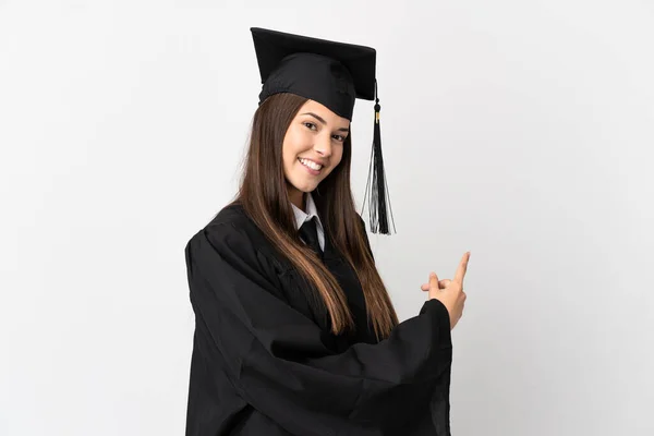 Adolescente Graduado Universitario Brasileño Sobre Fondo Blanco Aislado Apuntando Hacia —  Fotos de Stock