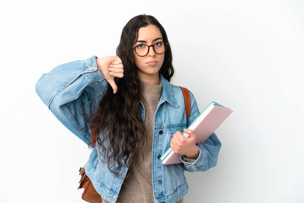 Молода Студентка Ізольована Білому Тлі Показуючи Великий Палець Вниз Негативним — стокове фото