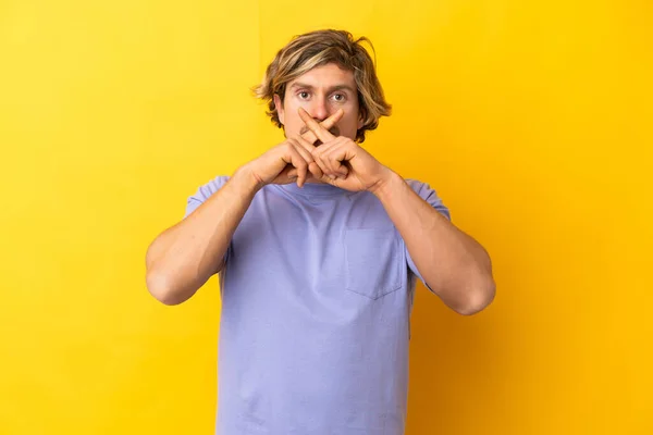 Handsome Blonde Man Isolated Yellow Background Showing Sign Silence Gesture — стоковое фото