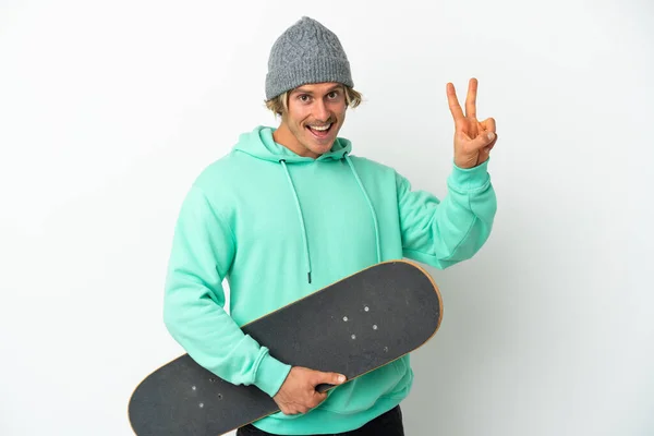 Young Skater Blonde Man Isolated White Background Smiling Showing Victory — Stock Photo, Image
