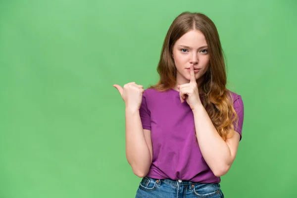 Young Pretty Woman Isolated Background Pointing Side Doing Silence Gesture — Stock Photo, Image