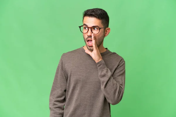 Young Handsome Caucasian Man Isolated Background Whispering Something Surprise Gesture — Stock Photo, Image