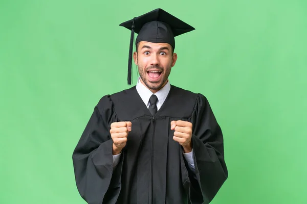 Jovem Graduado Universitário Sobre Fundo Isolado Celebrando Uma Vitória Posição — Fotografia de Stock