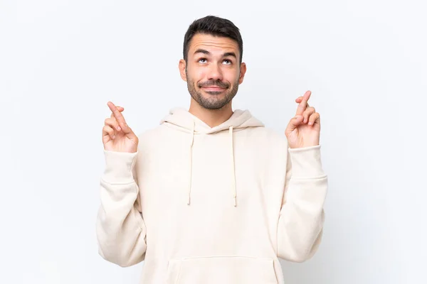 Jonge Blanke Man Geïsoleerd Witte Achtergrond Met Vingers Kruisen Wensen — Stockfoto