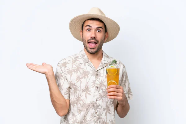 Young Caucasian Man Holding Cocktail Isolated White Background Shocked Facial — Stock Photo, Image