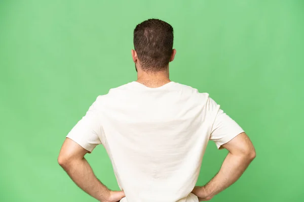 Jonge Knappe Blanke Man Geïsoleerd Groene Chroma Achtergrond Achterste Positie — Stockfoto