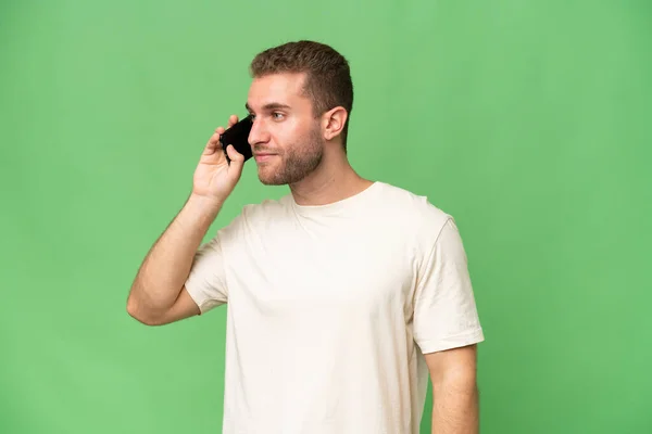 Young Handsome Caucasian Man Isolated Green Chroma Background Keeping Conversation — Stock Photo, Image