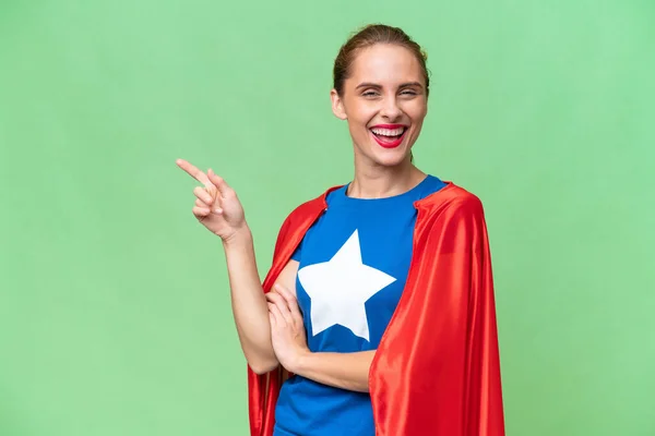 Super Hero Caucasian Woman Isolated Background Pointing Finger Side — Stock Photo, Image