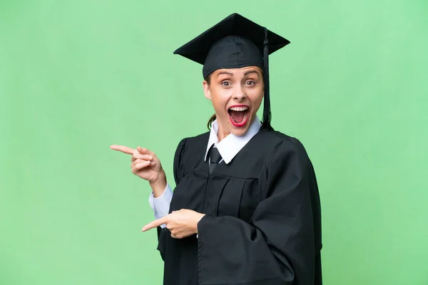 Young University Graduate Caucasian Woman Isolated Background Surprised Pointing Side — Stock Photo, Image