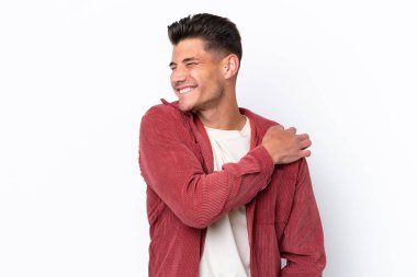 Young caucasian man isolated on white background suffering from pain in shoulder for having made an effort