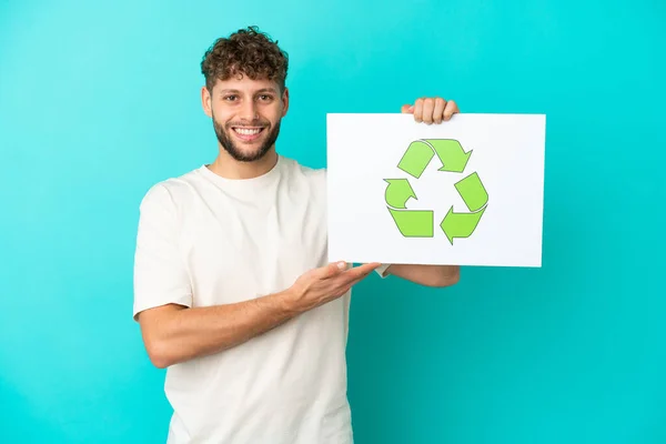 Young Handsome Caucasian Man Isolated Blue Background Holding Placard Recycle — Stock Photo, Image