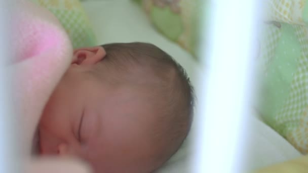 Beautiful infant baby girl in bed — Stock Video