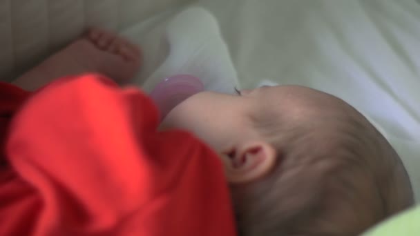 Beautiful infant baby girl in bed — Stock Video