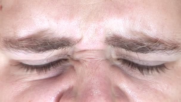 Young man's face close-up — Stockvideo