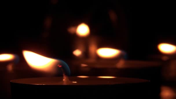 Candle burning inside a candle holder — Stock videók