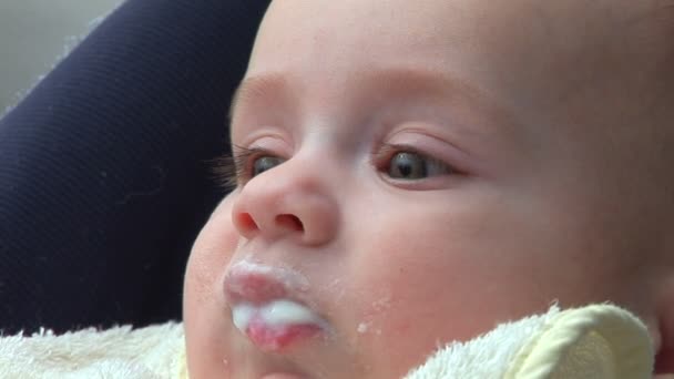 Baby eating and smiling — Stock Video