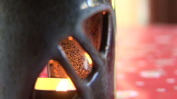 Candle burning inside a candle holder — Stock videók