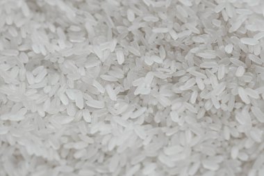 Çiğ pirinç. Pirinç dokusunun arka planı. Sağlıklı ve spor beslenmesi.