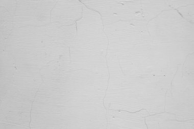 Üzerinde çatlaklar olan beyaz ve gri bir duvar. Beton ve çimento dokusu. Sıva. Grunge 'un geçmişi. Eski beton yüzey.