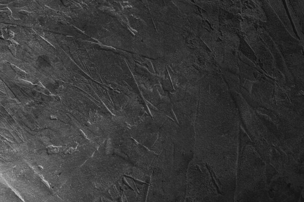 Темный цементный фон для граненого дизайна. Бетонная стена. Серый гипс.