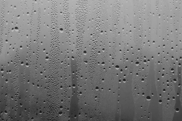 Gotas Lluvia Cristal Ventana Sobre Fondo Gris Patrón Natural Gotas — Foto de Stock