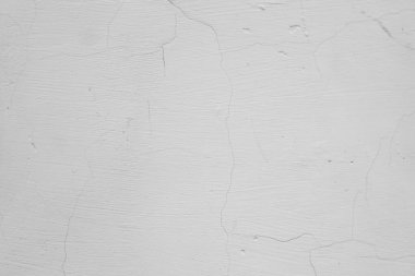 Üzerinde çatlaklar olan beyaz ve gri bir duvar. Beton ve çimento dokusu. Sıva. Grunge 'un geçmişi. Eski beton yüzey.