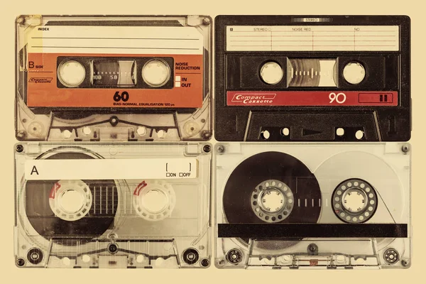 Retro Style Image Four Old Audio Compact Cassettes Sepia Background — стоковое фото