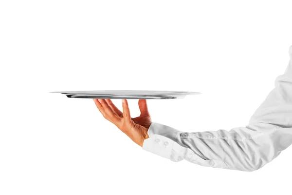 Eine Hand hält ein silbernes Tablett — Stockfoto