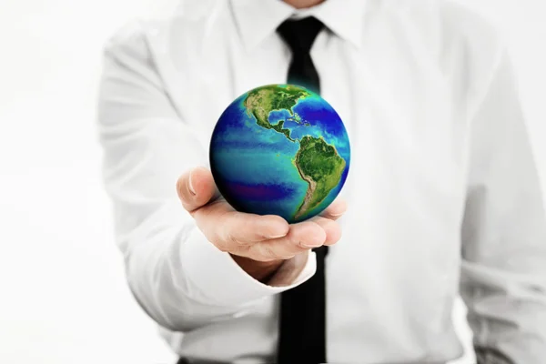 Man med en jorden-världen i sin hand — Stockfoto