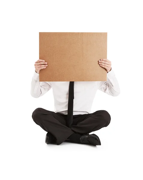 Man holding on his face cardboard — Stock Photo, Image