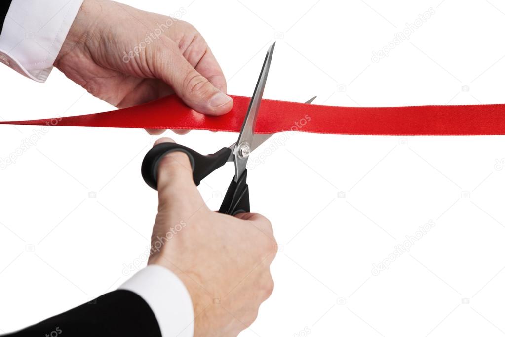 Cutting red ribbon