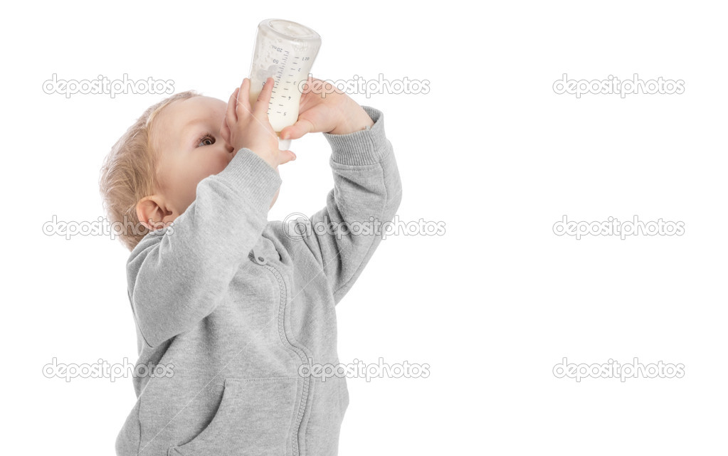 Little boy drinking milk from bottle