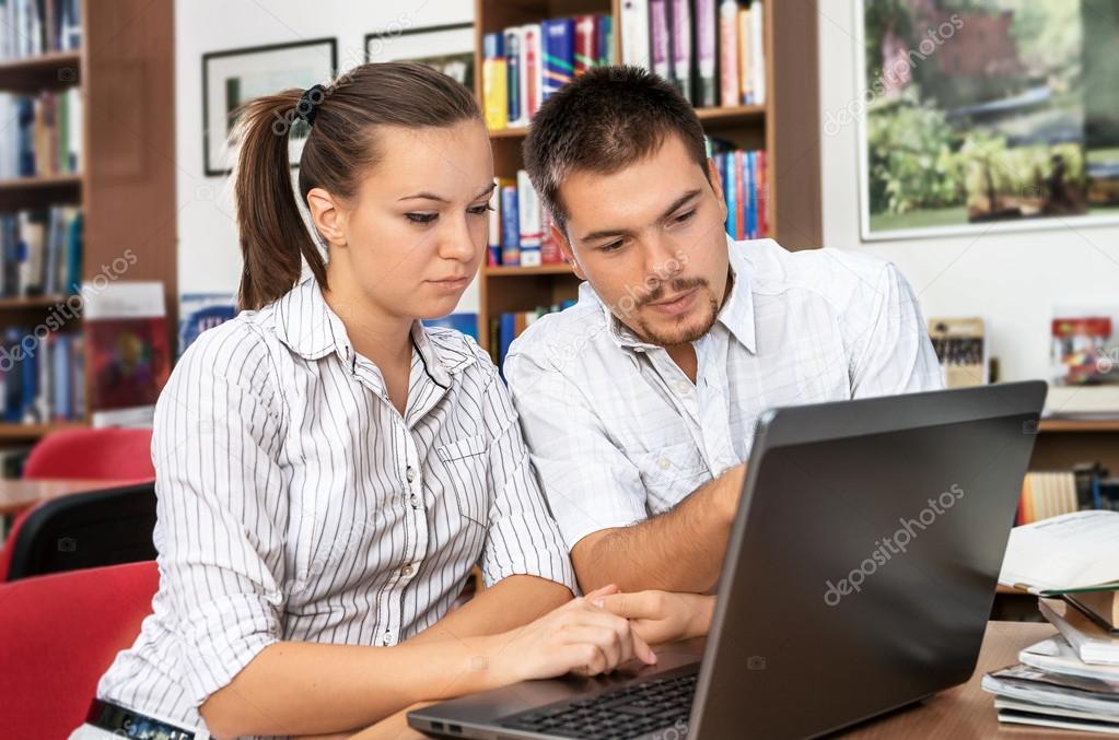 Students learn online in a library