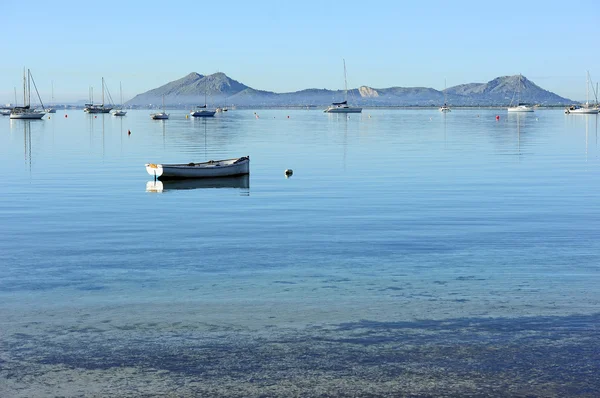 Boat on water near the coast — Stock Photo, Image