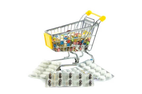 Carrello shopping con pillole isolate su sfondo bianco — Foto Stock